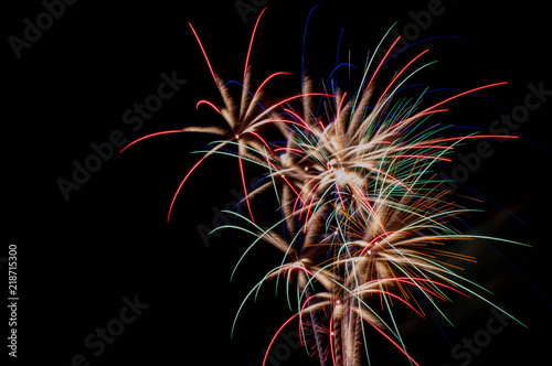 Fireworks exploding at night