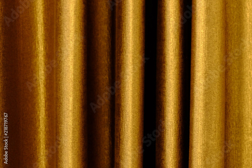 close up of background texture a gold fabric pattern.
