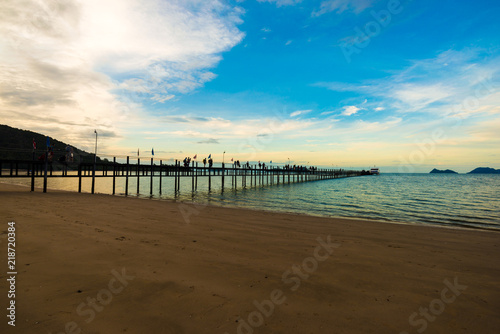 Wooden bridge on sea beach sunrise colorful sky