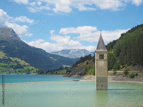Curon  Italy. View of the old bell tower of the village rising out of the waters lake of Resia