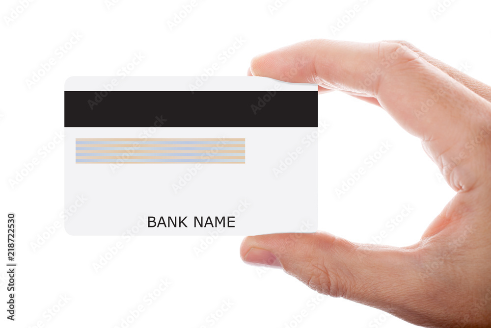 Hand holding credit card isolated on white background Hand holding credit card isolated on white background