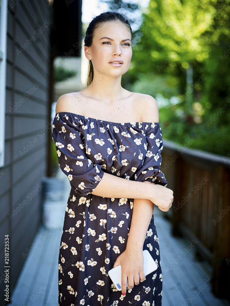 Fototapeta premium Outdoor atmospheric fashion photo of young beautiful lady
