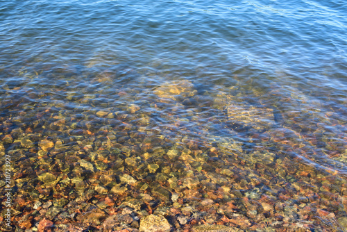 Fototapeta Naklejka Na Ścianę i Meble -  Defocus Natural abstract background of sea pebbles water .
