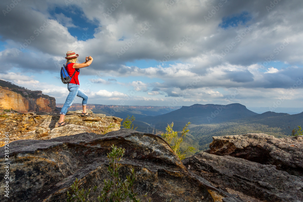 Tourist taking photos of stunning Blue Mountain vistas