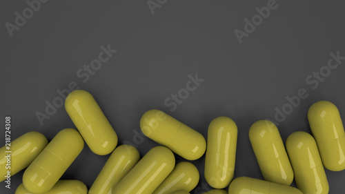 Pile of yellow medicine capsules
