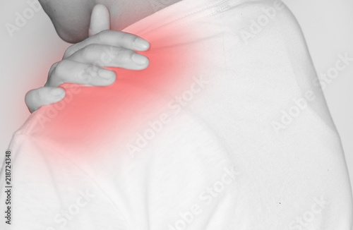 Man suffering from shoulder pain on white background , Healthcare and medical concept..