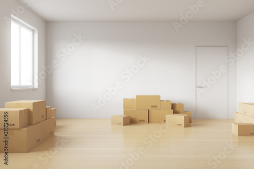 Empty room full of cardboard boxes to move into a new house. 3d rendering © katestudio