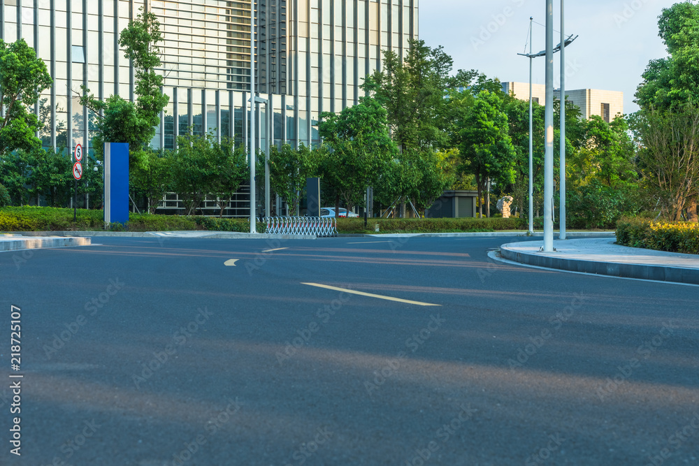 Empty urban road near modern office buildings