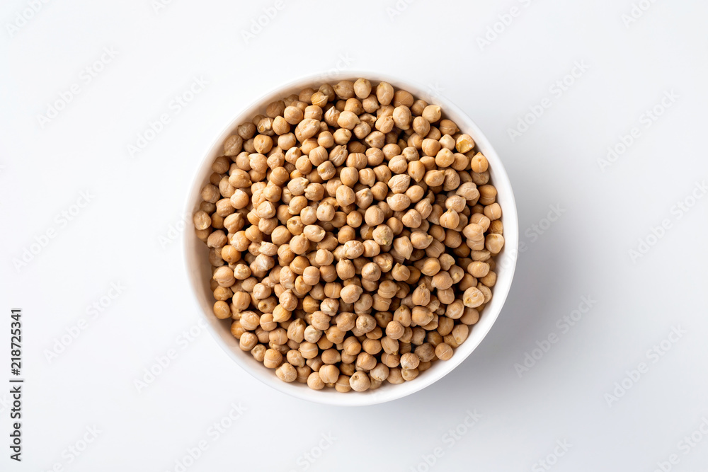Closeup top view bowl of uncooked chickpeas isolated at white background. Closeup top view bowl of uncooked chickpeas isolated at white background.