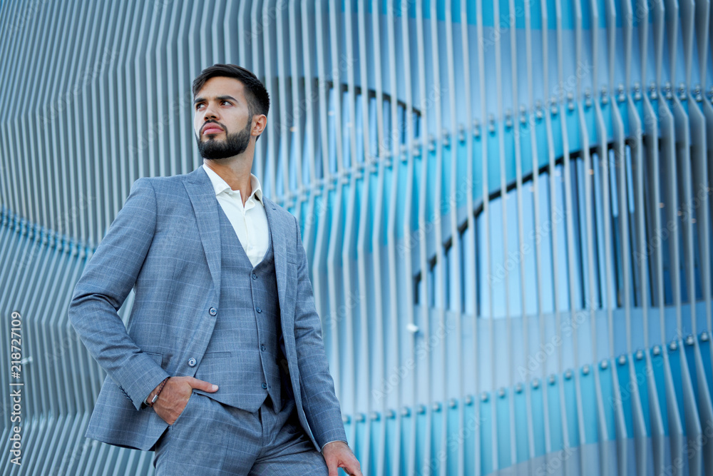 Businessman style. Men style. Man in custom tailored business suit posing outdoors Businessman style. Men style. Man in custom tailored business suit posing outdoors