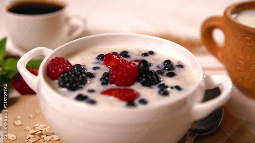 Oats porridge with fresh berries and milk Oats porridge with fresh berries and milk