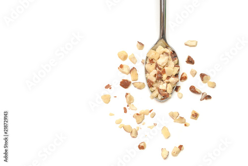 Diced Almond in a spoon on white background - isolated