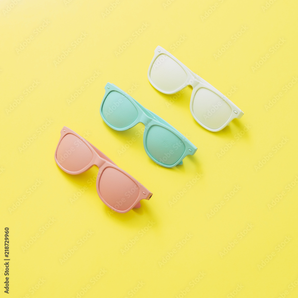 Sunglasses painted in white, pink and blue colors. Fashion accessories for woman. Minimalism Sunglasses painted in white, pink and blue colors. Fashion accessories for woman. Minimalism