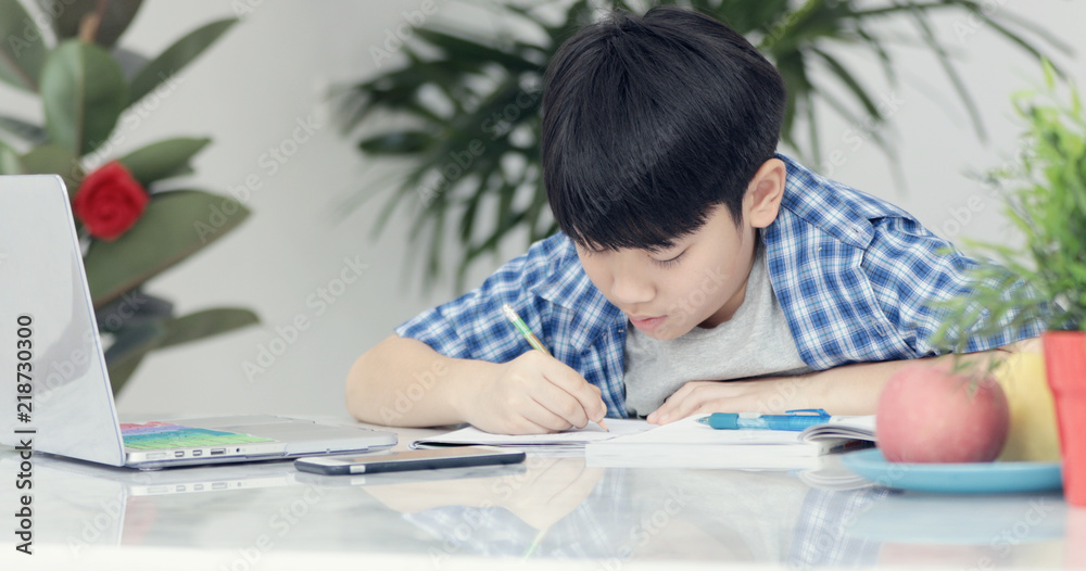 Asian preteens doing your homework with tablet. Asian preteens doing your homework with tablet.
