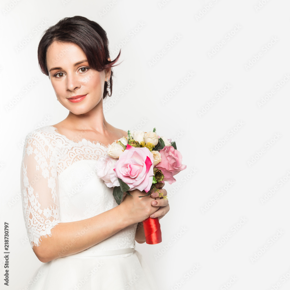 elegant bride on a light background. Beautiful wedding bouquet in a bride hands. free space for your text elegant bride on a light background. Beautiful wedding bouquet in a bride hands. free space for your text