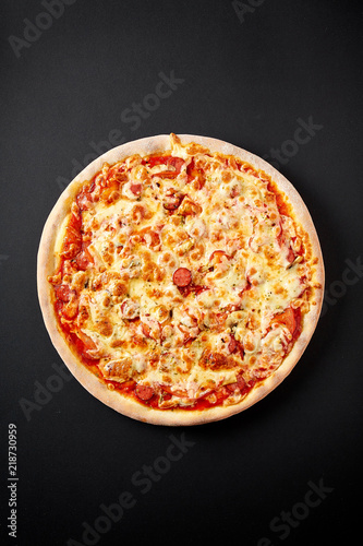 Bavarian pizza. Hot pizza on black background for lunch or dinner crust. Pizza menu.