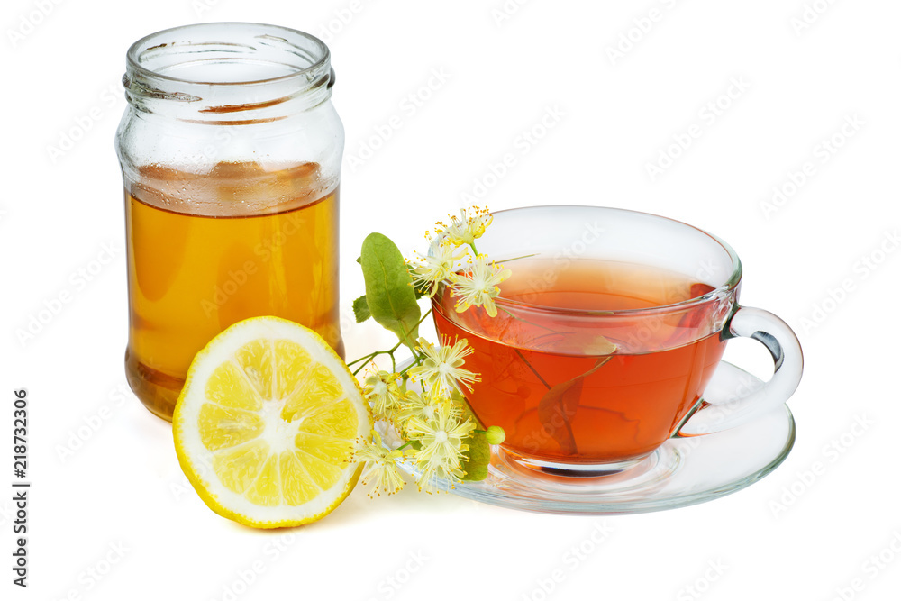 Herbal tea, jar of honey, lemon half and linden blossom Herbal tea, jar of honey, lemon half and linden blossom