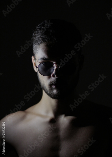 photos of a guy, a portrait photo, a guy with glasses, a model appearance.