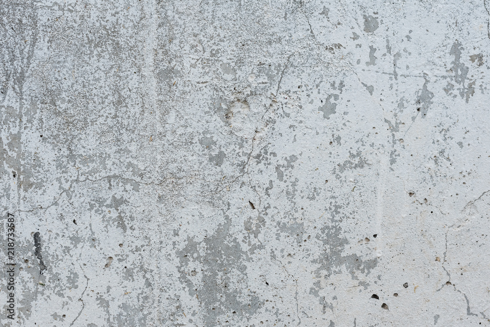 Wall fragment with scratches and cracks. It can be used as a background Wall fragment with scratches and cracks. It can be used as a background
