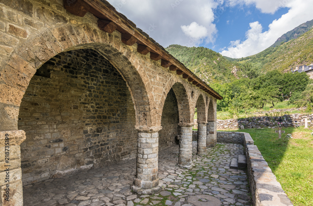 Romanesque porch and church of Santa Eulalia de Erill la vall, Catalonia, Spain.