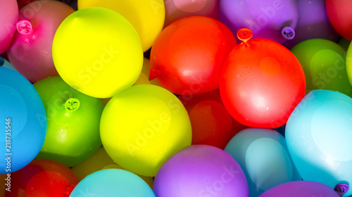 Many bright and colorful water balloons
