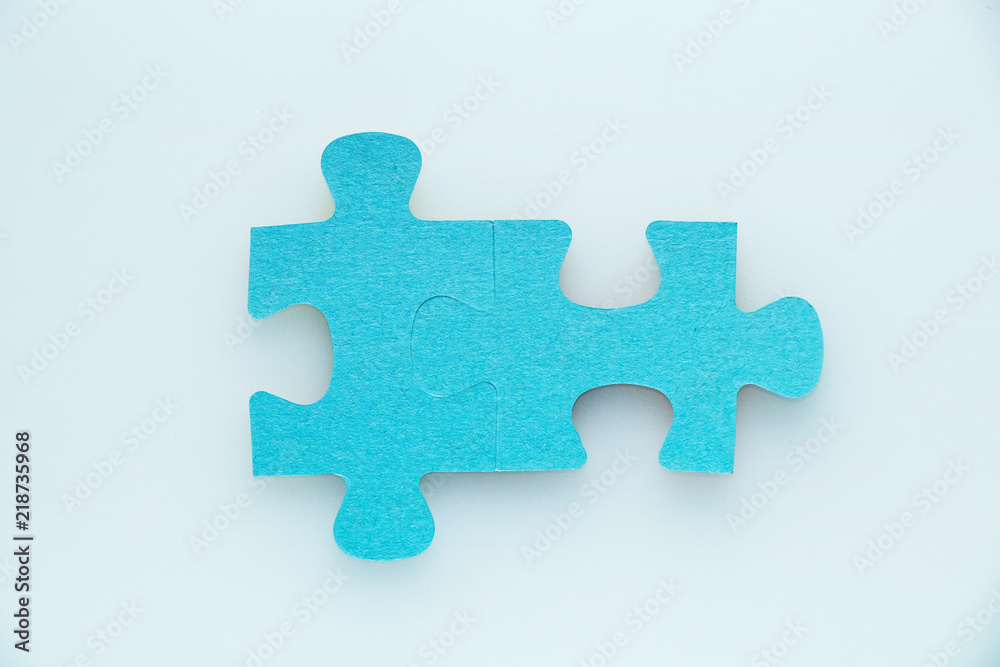 Two pieces of a puzzle piece on a white background. Two pieces of a puzzle piece on a white background.
