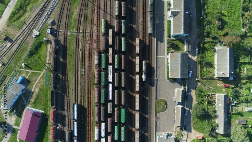 Logistics in manufacture, aerial view of freight trains laden with granite and marble, moving train, industrial landscape. Logistics in manufacture, aerial view of freight trains laden with granite and marble, moving train, industrial landscape.
