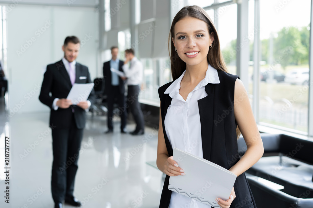 Modern business woman in the office with copy space. Modern business woman in the office with copy space.
