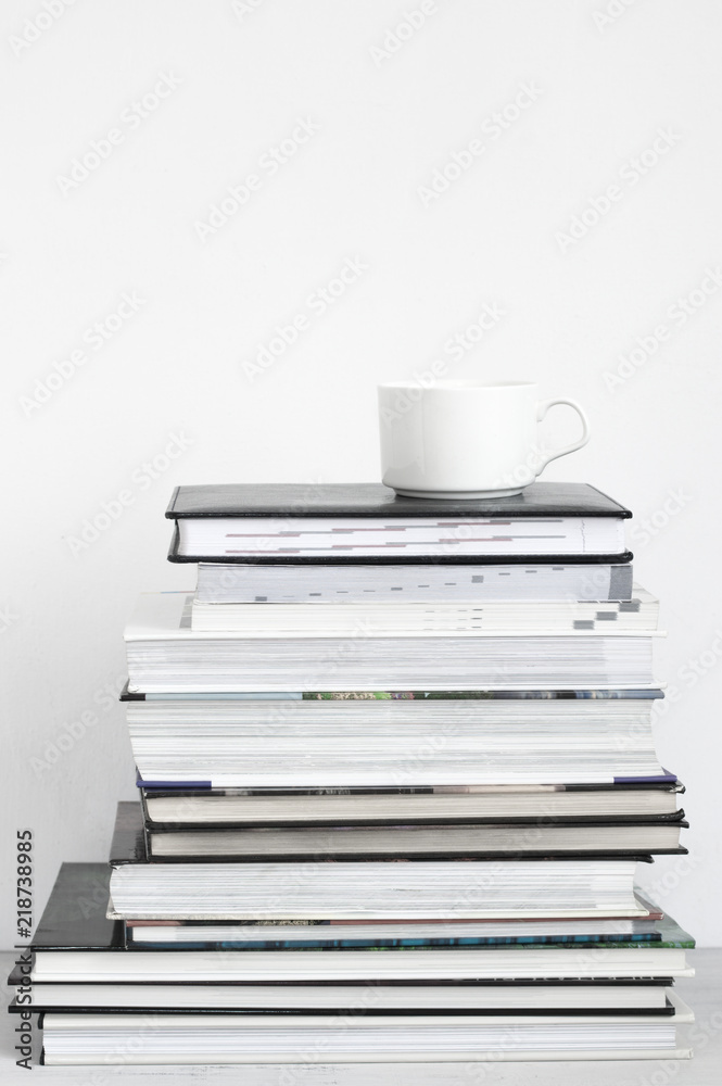 Cup of coffee on stack of books Cup of coffee on stack of books