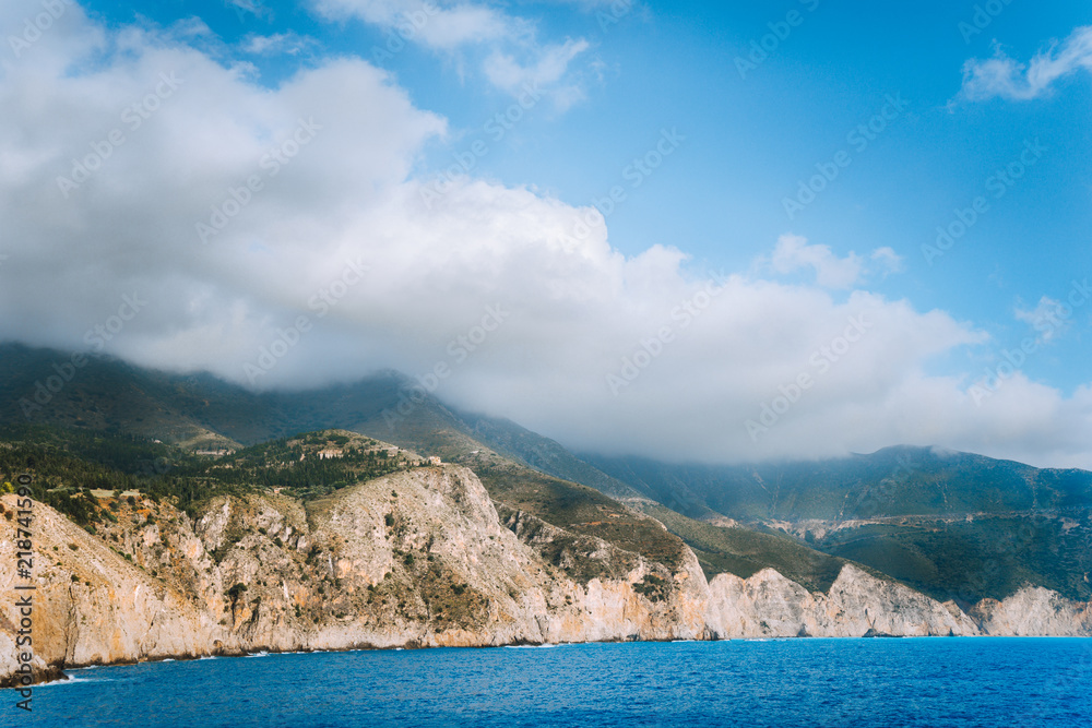 Picturesque rocky coastline on Kefalonia island. Amazing landscape in soft light with cloudscape