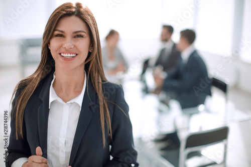 Fotografie young business woman on the background of the office