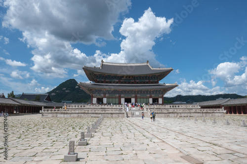 Gyeongbokgung Palace pavilion with pavement, mountains and clouds