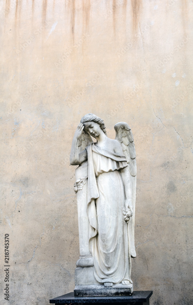 Sepulchral sculpture of Angel in Poblenou Cemetery. Peaceful but macabre, cemetery of Poblenou is today home to incredible sculptures, haunting, yet beautiful.