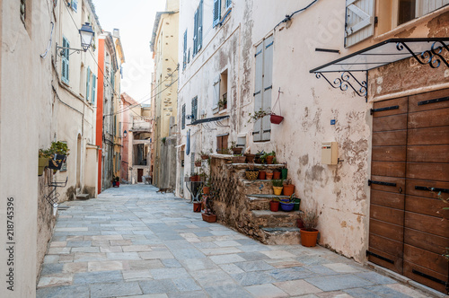 A narrow street at Bastia, in the old medieval city of Citadel, a popular destination for travel in Europe, France, Corsica © olezzo