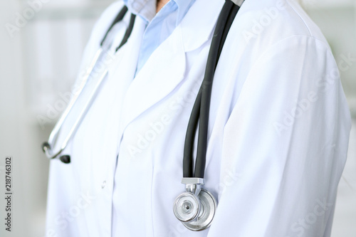 Doctor woman working at hospital. Closeup of stethoscope. Health care, insurance and help concept