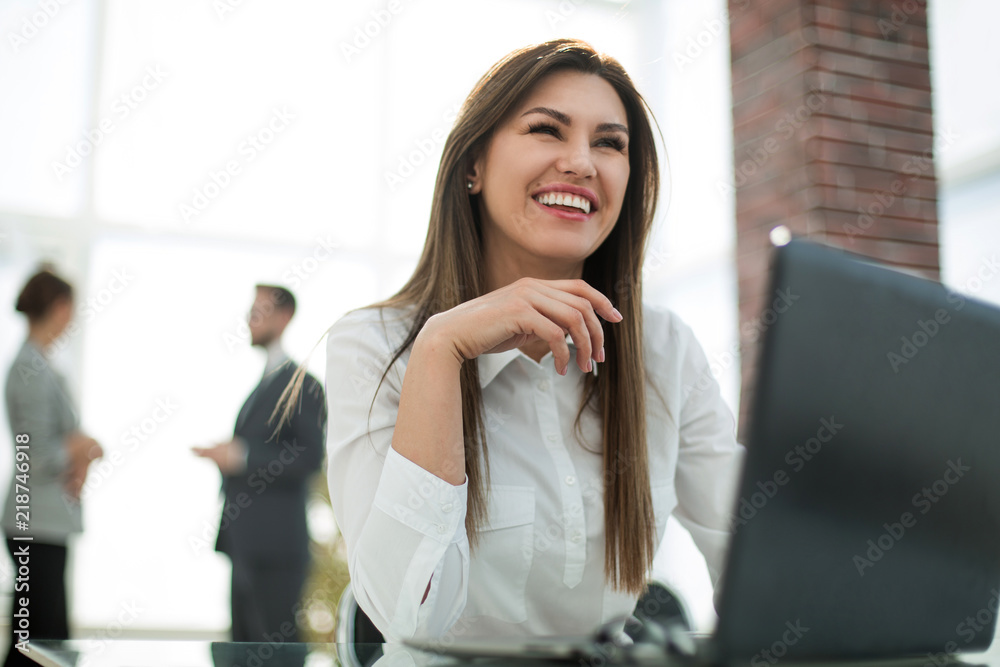 close up.smiling business woman at workplace in office close up.smiling business woman at workplace in office