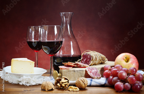 Salami, cheese, grapes and red wine