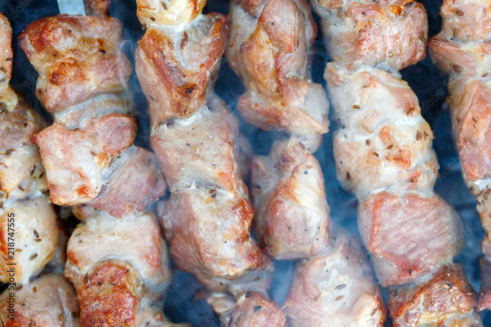 Barbecue skewers with meat on the brazier. Pork shish kebab