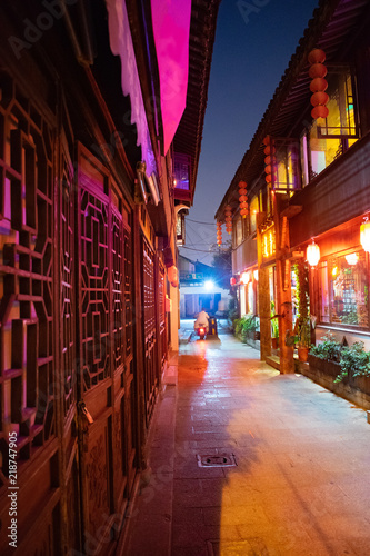 Narrow street with old wooden buildings 