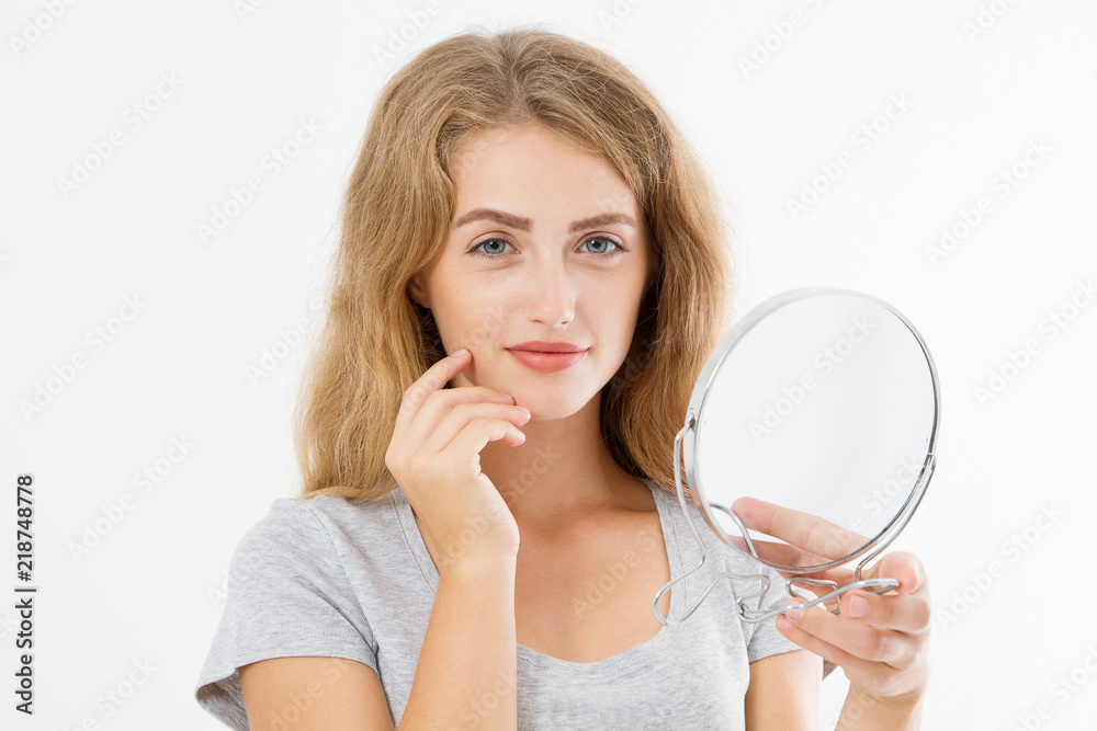 Young caucasian blonde woman looking wrinkles on face in mirror isolated on white background. Skin care and makeup concept. Copy space Young caucasian blonde woman looking wrinkles on face in mirror isolated on white background. Skin care and makeup concept. Copy space