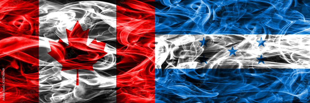 Obraz premium Canada vs Honduras smoke flags placed side by side. Canadian and Honduras flag together