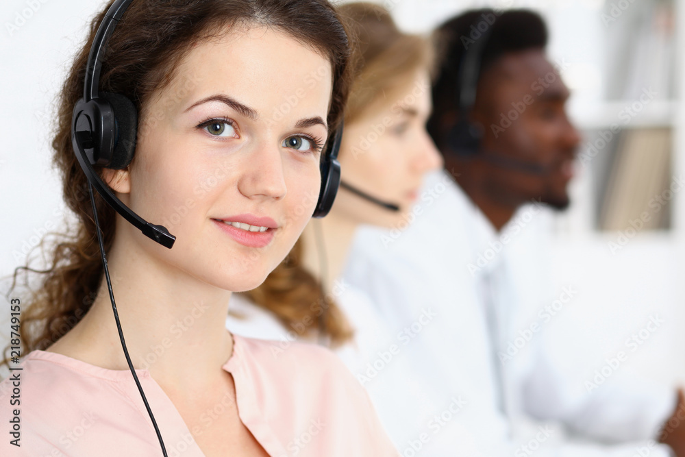 Call center operator.Young beautiful brunette woman in headset. Business concept Call center operator.Young beautiful brunette woman in headset. Business concept