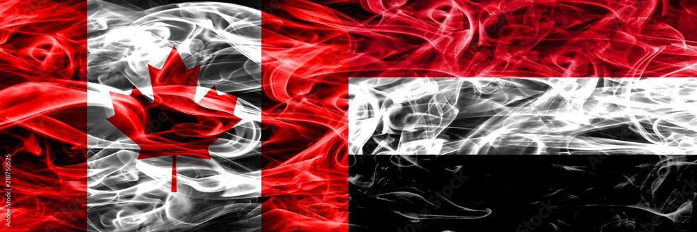 Canada vs Yemen smoke flags placed side by side. Canadian and Yemen flag together Canada vs Yemen smoke flags placed side by side. Canadian and Yemen flag together