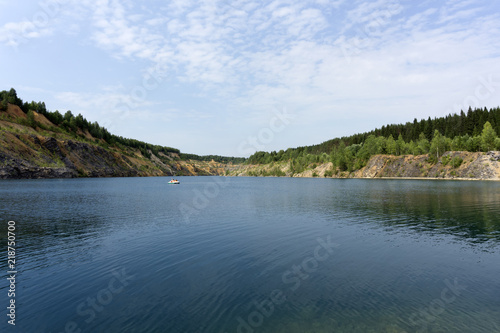 lake with blue water, a place of recreation formed on the site of old abandoned quarry..