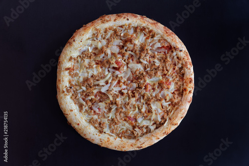 Backed tuna pizza on black background - ready to eat