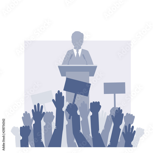 Speaker stands in front of the crowd.