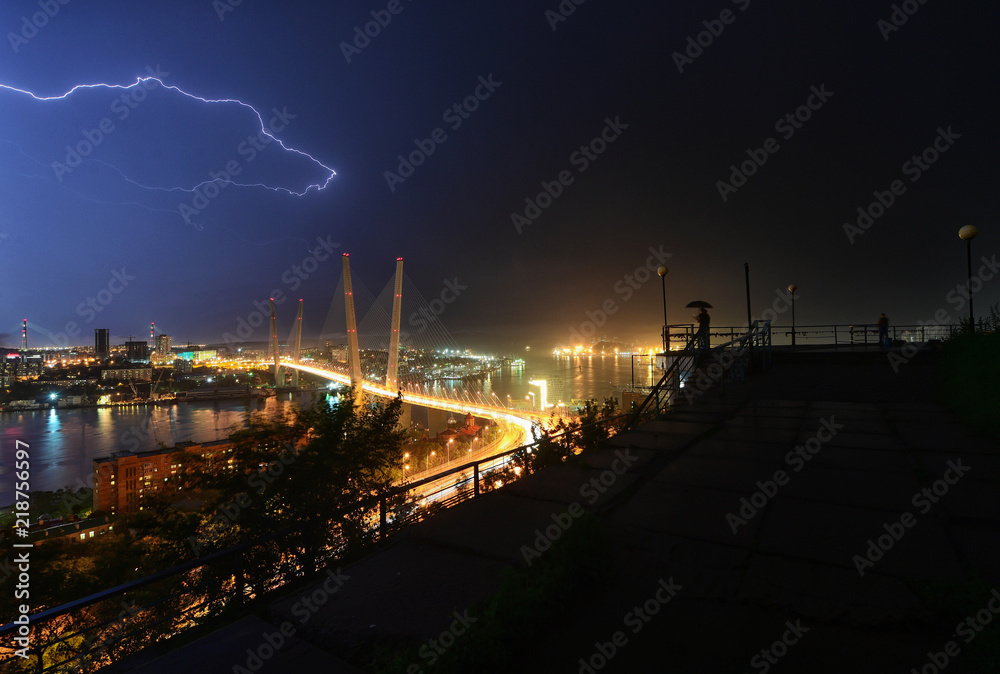 Lightning above the bridge in the city of Vladivostok