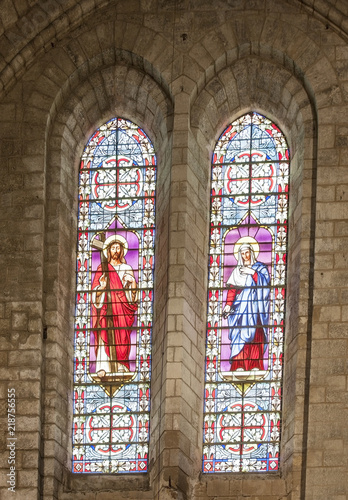 ancient stained-glass windows in the cathedral in the city of Beziers. photo