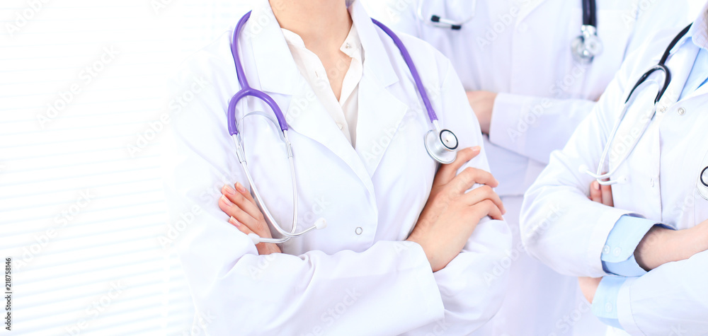 Group of unknown doctors at hospital. Teamwork and success concept in medicine Group of unknown doctors at hospital. Teamwork and success concept in medicine
