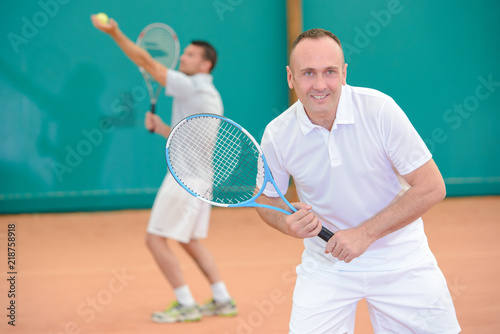 Men playng tennis doubles © auremar